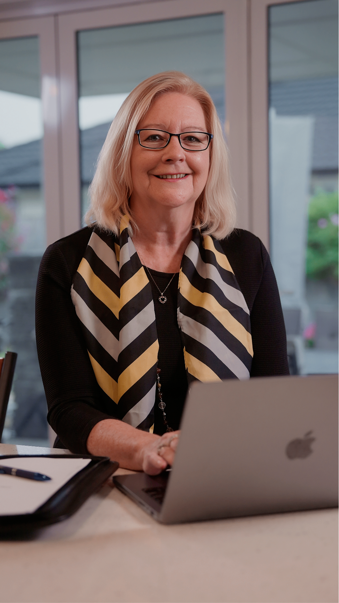 Donna working with a client from her laptop