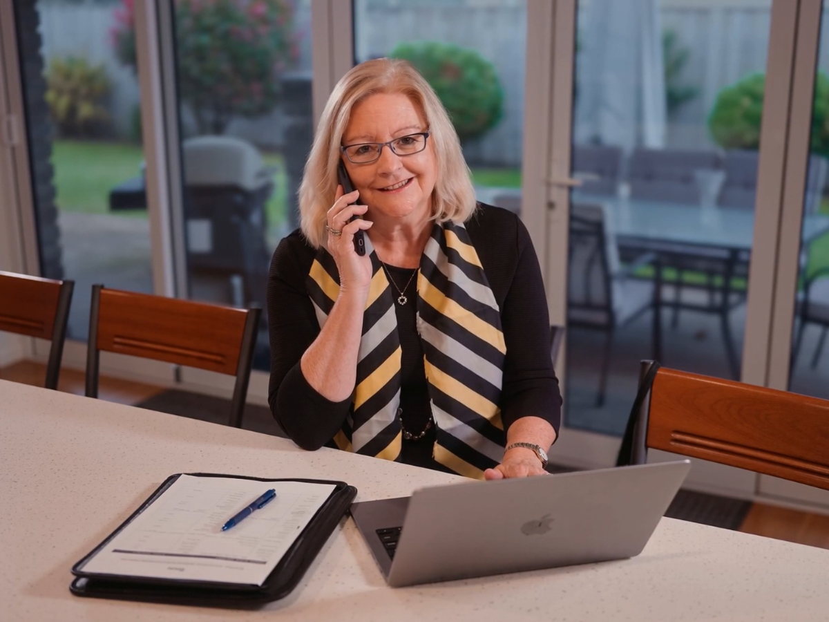 Donna on a phone call with a client